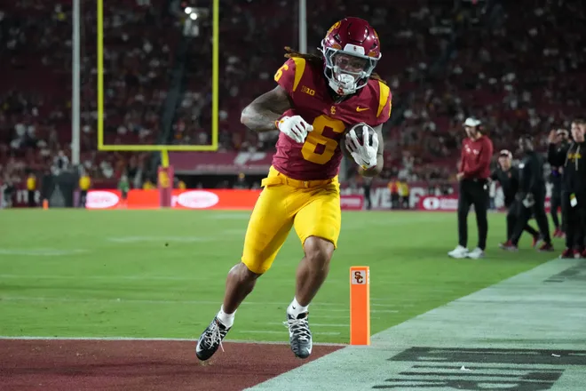 Sep 4, 2026; Los Angeles, California, USA; Southern California Trojans running back Deshonne Redeaux (6) carries the ball on a 5-yard touchdown run against the Fresno State Bulldogs in the second half at United Airlines Field at Los Angeles Memorial Coliseum. Mandatory Credit: Kirby Lee-Imagn Images
