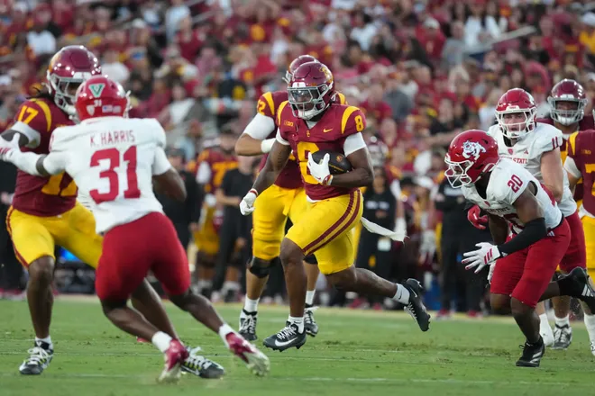 Sep 4, 2026; Los Angeles, California, USA; Southern California Trojans running back King Miller (8) carries the ball against the Fresno State Bulldogs in the first half at United Airlines Field at Los Angeles Memorial Coliseum. Mandatory Credit: Kirby Lee-Imagn Images