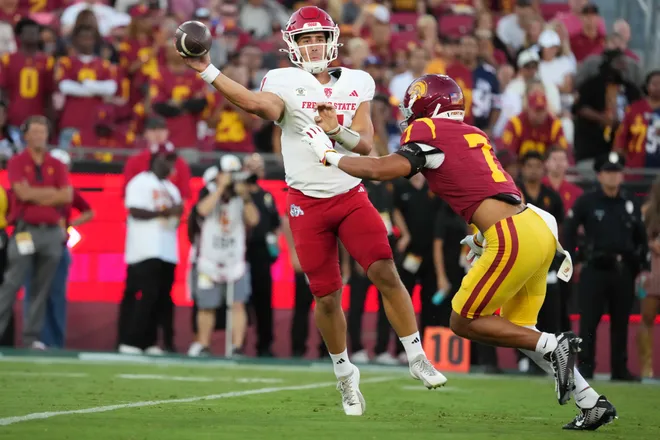Sep 4, 2026; Los Angeles, California, USA;Fresno State Bulldogs quarterback Jayden Mandal (7) throws the ball against Southern California Trojans cornerback Alex Graham (7) in the first half at United Airlines Field at Los Angeles Memorial Coliseum. Mandatory Credit: Kirby Lee-Imagn Images