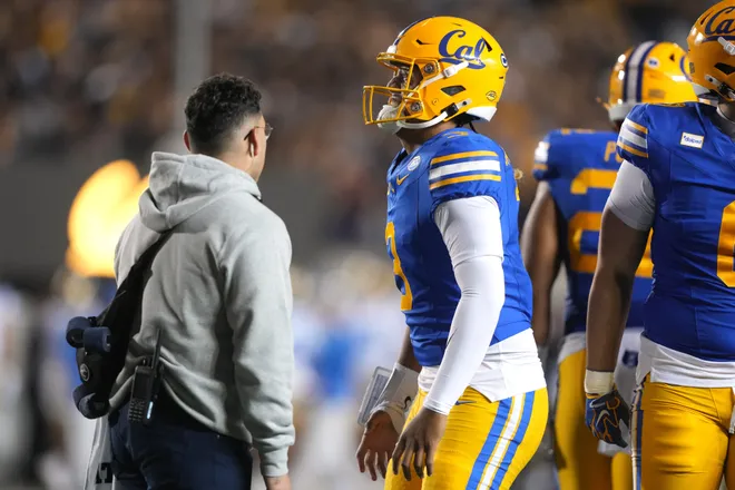 Sep 5, 2026; Berkeley, California, USA; California Golden Bears quarterback Jaron-Keawe Sagapolutele (3) grimaces while being examined by medical personnel during the second quarter against the UCLA Bruins at California Memorial Stadium. Mandatory Credit: Darren Yamashita-Imagn Images