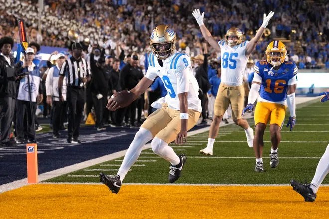 Sep 5, 2026; Berkeley, California, USA; UCLA Bruins quarterback Nico Iamaleava (9) scores a touchdown against the California Golden Bears during the first quarter at California Memorial Stadium. Mandatory Credit: Darren Yamashita-Imagn Images
