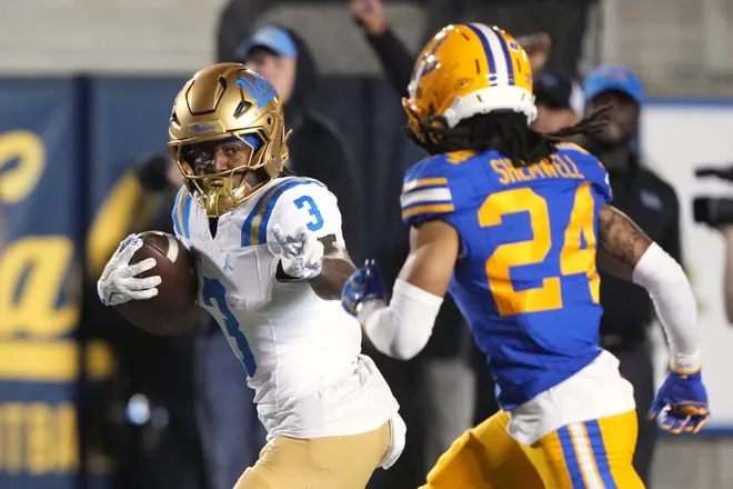 Sep 5, 2026; Berkeley, California, USA; UCLA Bruins running back Wayne Knight (3) gestures towards California Golden Bears defensive back Quimari Shemwell (24) during a touchdown run during the fourth quarter at California Memorial Stadium. Mandatory Credit: Darren Yamashita-Imagn Images