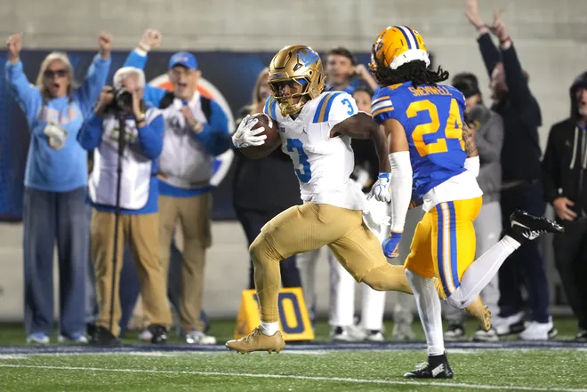Sep 5, 2026; Berkeley, California, USA; UCLA Bruins running back Wayne Knight (3) rushes for a touchdown against California Golden Bears defensive back Quimari Shemwell (24) during the fourth quarter at California Memorial Stadium. Mandatory Credit: Darren Yamashita-Imagn Images