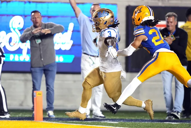 Sep 5, 2026; Berkeley, California, USA; UCLA Bruins running back Wayne Knight (3) scores a touchdown against California Golden Bears defensive back Quimari Shemwell (24) during the fourth quarter at California Memorial Stadium. Mandatory Credit: Darren Yamashita-Imagn Images