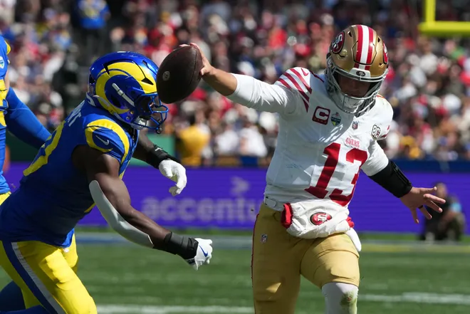 Sep 11, 2026; Melbourne, AUS; San Francisco 49ers quarterback Brock Purdy (13) rushes the ball in the second half against the Los Angeles Rams at Melbourne Cricket Ground. Mandatory Credit: Kirby Lee-Imagn Images