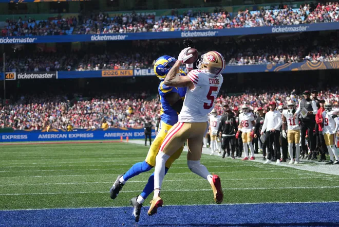 Sep 11, 2026; Melbourne, AUS; San Francisco 49ers wide receiver Mike Evans (5) makes a touchdown catch over Los Angeles Rams cornerback Jaylen Watson (35) in the second half at Melbourne Cricket Ground. Mandatory Credit: Kirby Lee-Imagn Images