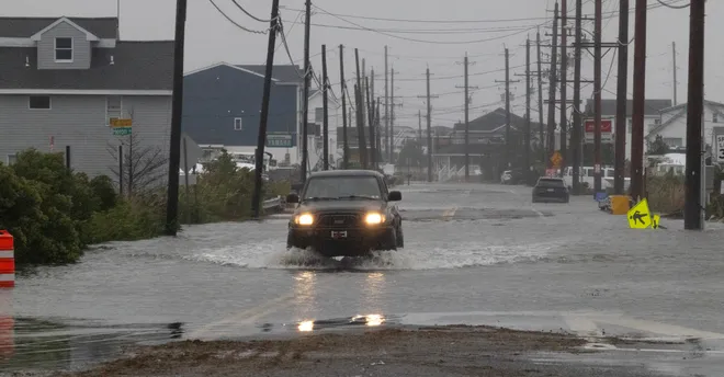 A small truck braves the flooding on East Bay Avenue in Stafford. High tides and the nor’easter made flooding a common problem the morning of Saturday, Sept. 26, 2026, throughout Ocean County.