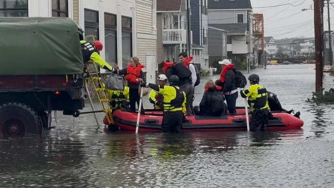 Rescue workers help a family stranded by flooded streets in Sea Bright as a nor'easter hit the Jersey Shore on Saturday, Sept. 26, 2026.