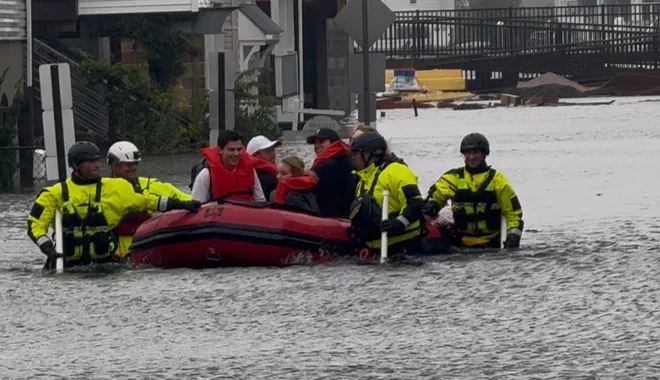 Rescue workers help a family stranded by flooded streets in Sea Bright as a nor'easter hit the Jersey Shore on Saturday, Sept. 26, 2026.