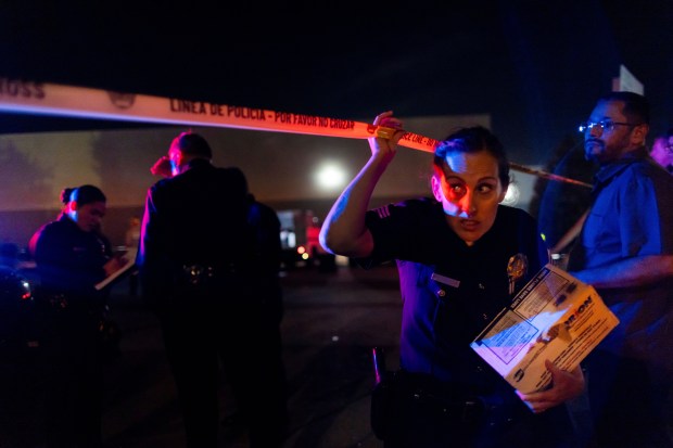 Investigators work the scene after a helicopter crashed near a bus crash in Chatsworth, a neighborhood in Los Angeles, Tuesday, Sept. 15, 2026. (AP Photo/Ethan Swope)