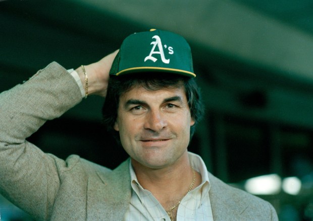 Former Chicago White Sox manager,Tony LaRussa, 41, tries on an Oakland A's cap at the San Francisco Airport after arriving from Chicago July 3, 1986. LaRussa agreed to a multi-year contract as manager with the A's after Jackie Moore was fired last week. (AP Photo/Paul Sakuma)