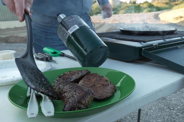 Cuts of grilled ostrich meat on a plate in Danville, Ky., on Tuesday, Aug. 18, 2026. (AP Photo/Dylan Lovan)
