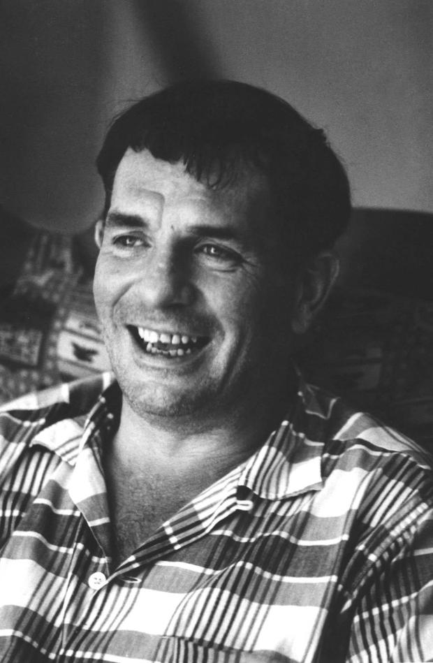 FILE - Author Jack Kerouac laughs during a visit to the home of a friend in Lowell, Mass. in 1967. (AP Photo/Stanley Twardowicz, File)