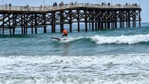 Trevor Holloway rides a wave, Saturday, during a 15 minute heat off Crystal Pier, September 12, 2026.