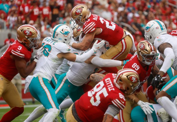 San Francisco 49ers' Christian McCaffrey (23) scores a touchdown against the Miami Dolphins in the third quarter at Levi's Stadium in Santa Clara, Calif., on Sunday, Sept. 20, 2026. (Nhat V. Meyer/Bay Area News Group)