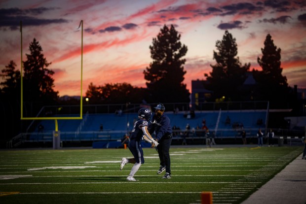 Bellarmine College Prep's Justin Donahue (22) high fives Bellarmine's assistant coach Jalal Beauchman after scoring touchdown against Campolindo at San Jose City College in San Jose, Calif., on Saturday, Sept. 5, 2026. (Shae Hammond/Bay Area News Group)