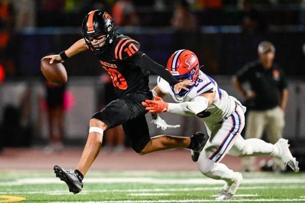 California's Nicco Kovacs (10) is sacked by Santa Teresa's Erick Arevalo (28) during the second half of a high school football game at California High School in San Ramon, Calif., on Friday, Sept. 11, 2026. (Thien-An Truong for Bay Area News Group)