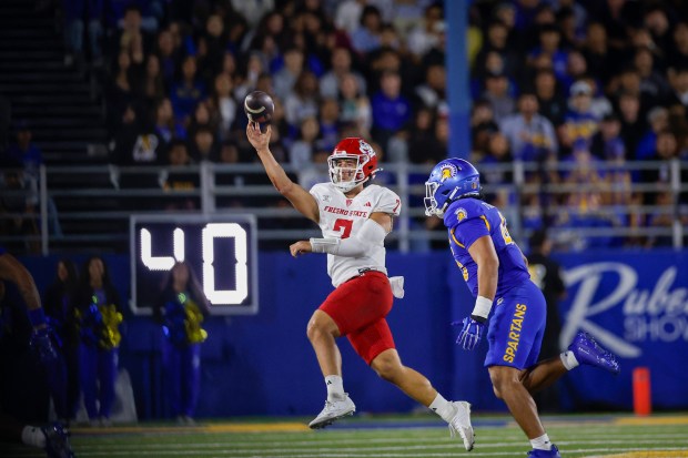 Fresno State Bulldogs' Jayden Mandal (7) throws the ball against San Jose State Spartans' Jeremiah Tuiileila (45) in the third quarter at CEFCU Stadium in San Jose, Calif., on Saturday, Sept. 19, 2026. (Shae Hammond/Bay Area News Group)