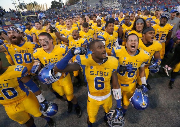 San Jose State players celebrate with fans after a 62-52 victory against Fresno State in an NCAA college football game on Friday, Nov. 29, 2013, in San Jose, Calif. (AP Photo/Tony Avelar)