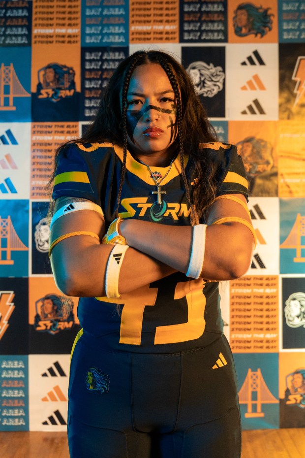 Golden State Storm linebacker Leilani Caamal poses in front of a team background. (Alex Llamas/Golden State Storm)