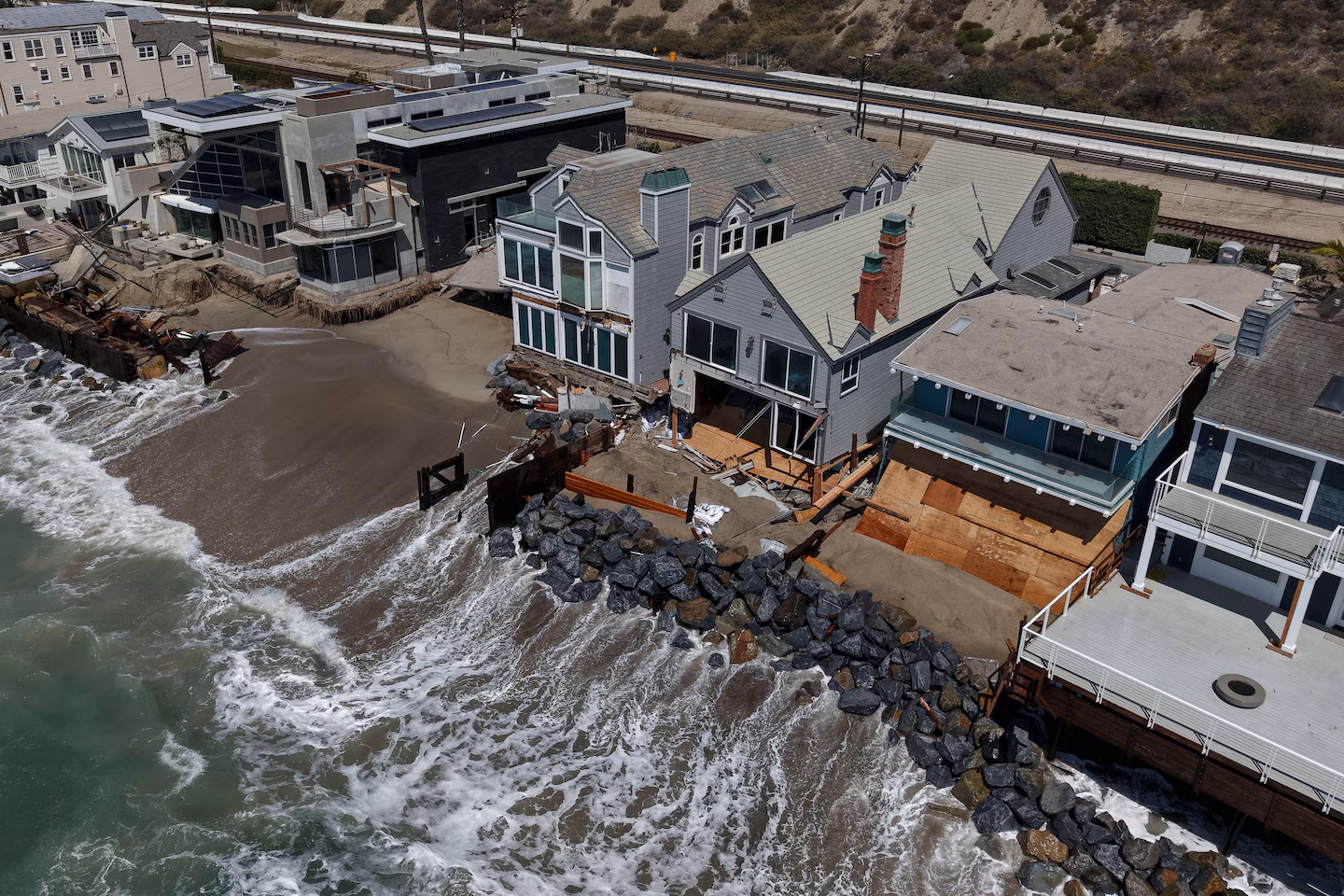 Fight intensifies over fate of California homes falling into the sea