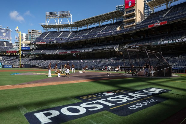 The Padres warm up before facing the Cubs in Game 1 of their wild-card series on Sept. 29, 2026, in San Diego. (Brian Cassella/Chicago Tribune)