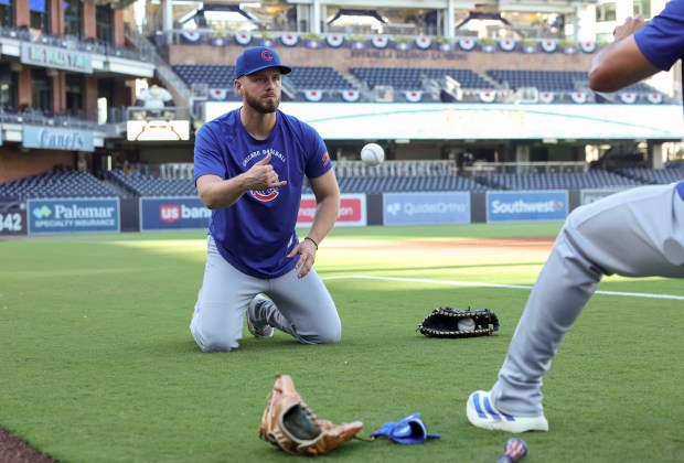 Cubs first baseman Michael Busch warms up to face the Padres before Game 1 of their wild-card series on Sept. 29, 2026, in San Diego. (Brian Cassella/Chicago Tribune)