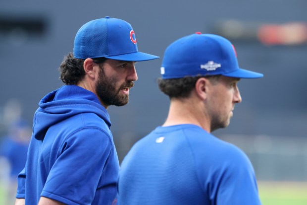 Cubs shortstop Dansby Swanson and designated hitter Alex Bregman watch batting practice before Game 1 of their wild-card series against the Padres on Sept. 29, 2026, in San Diego. (Brian Cassella/Chicago Tribune)