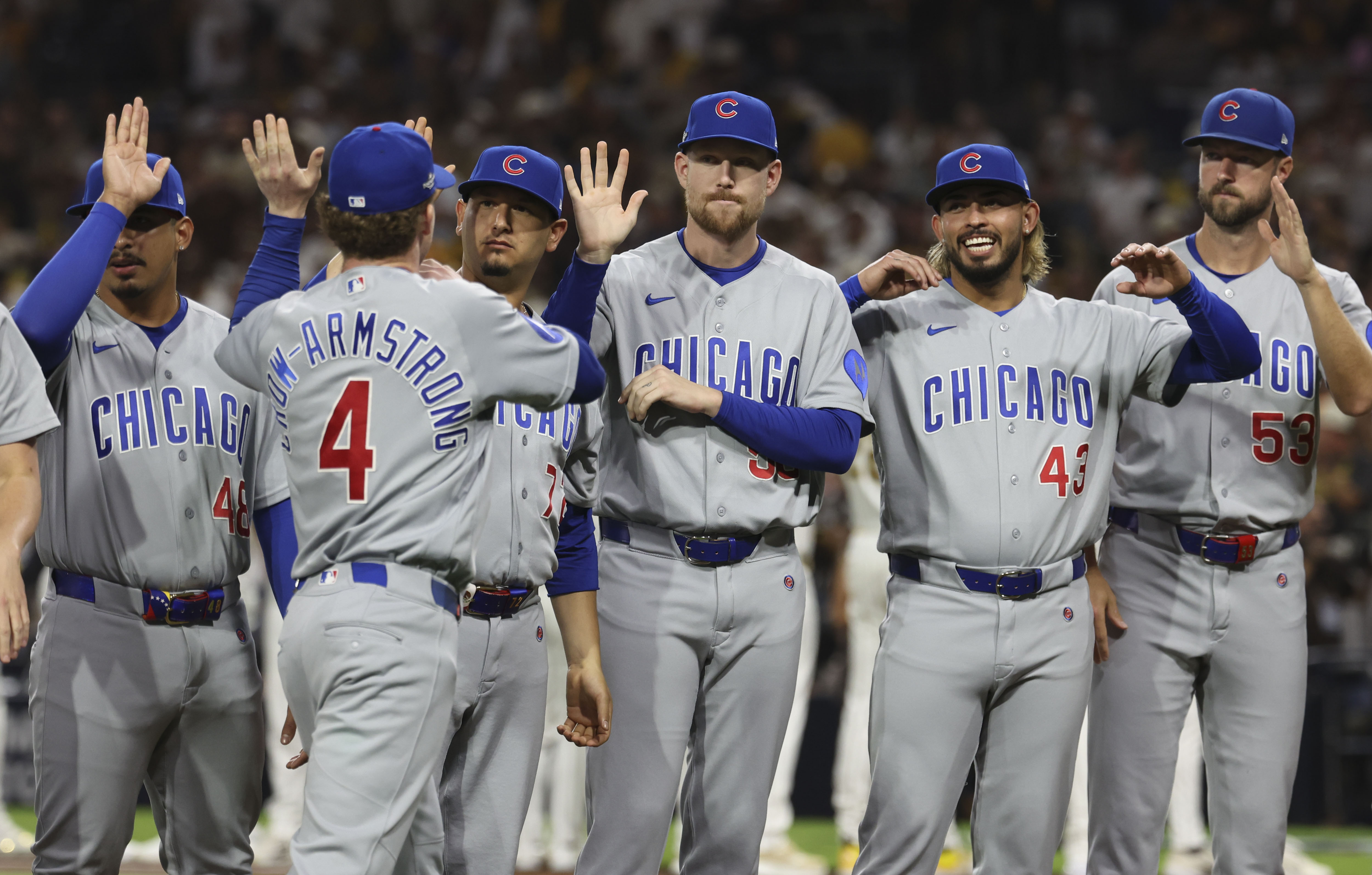 Cubs players greet center fielder Pete Crow-Armstrong before Game 1 of their wild-card series against the Padres on Sept. 29, 2026, in San Diego. (Brian Cassella/Chicago Tribune)