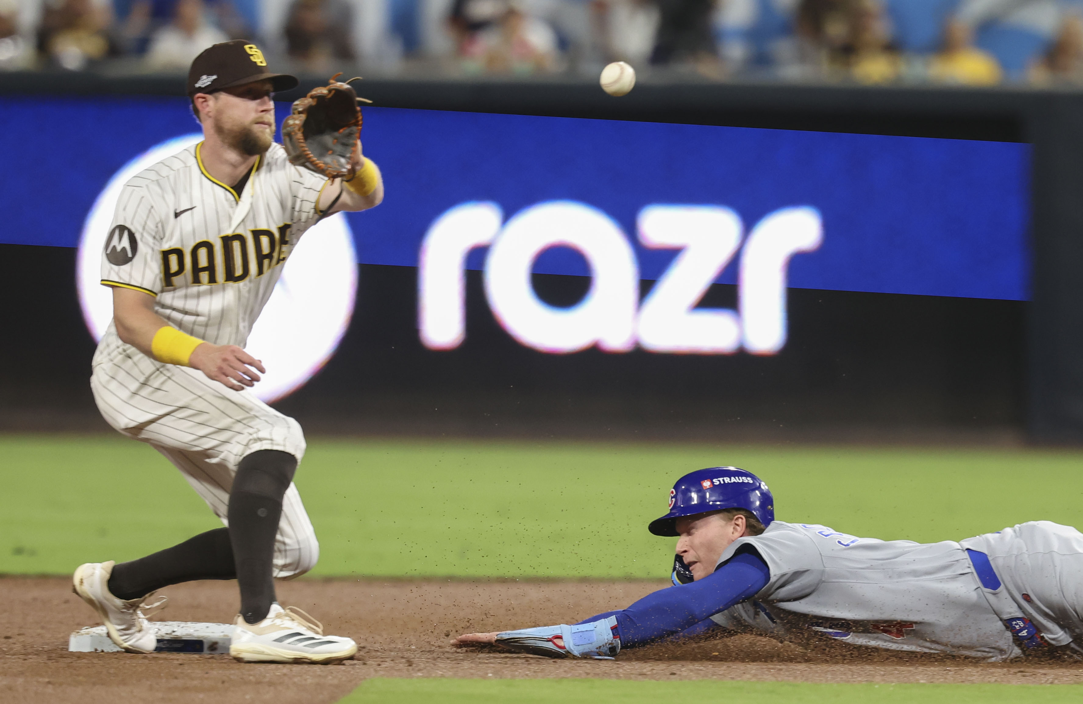 Cubs center fielder Pete Crow-Armstrong steals second base as Padres second baseman Jake Cronenworth awaits the throw in the third inning in Game 1 of their wild-card series on Sept. 29, 2026, in San Diego. (Brian Cassella/Chicago Tribune)