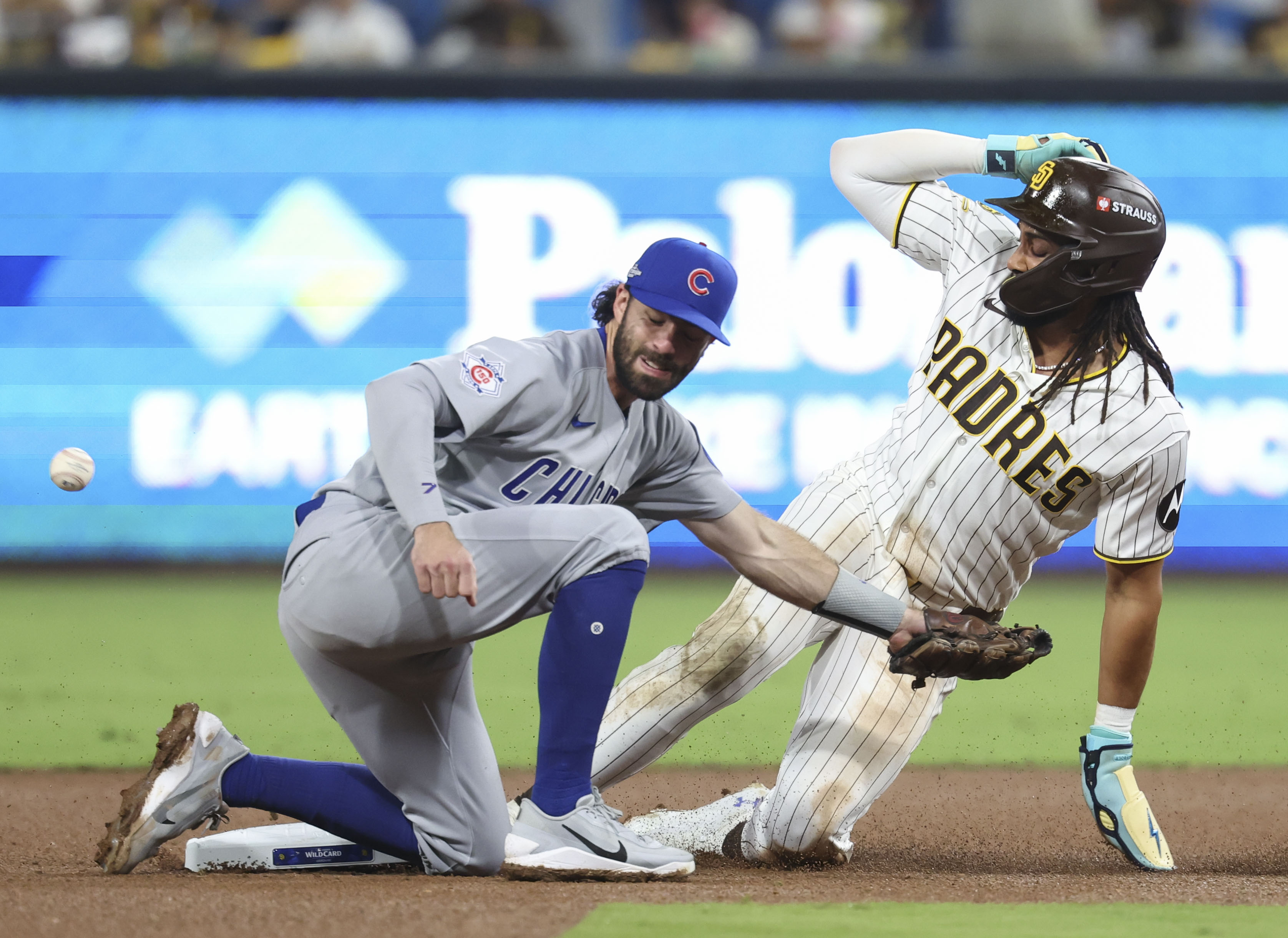 Padres right fielder Fernando Tatis Jr. steals second base as the ball gets by Cubs shortstop Dansby Swanson in the seventh inning in Game 1 of their wild-card series on Sept. 29, 2026, in San Diego. (Brian Cassella/Chicago Tribune)