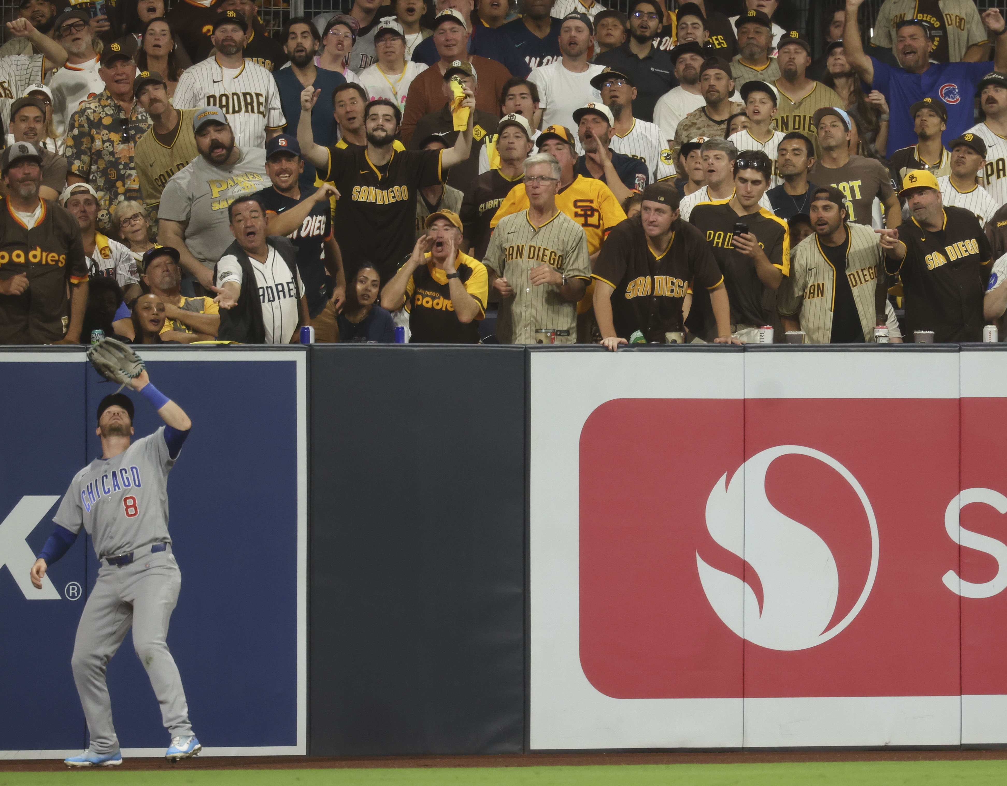 Padres fans watch Cubs left fielder Ian Happ catch a fly ball in the seventh inning in Game 1 of their wild-card series on Sept. 29, 2026, in San Diego. (Brian Cassella/Chicago Tribune)