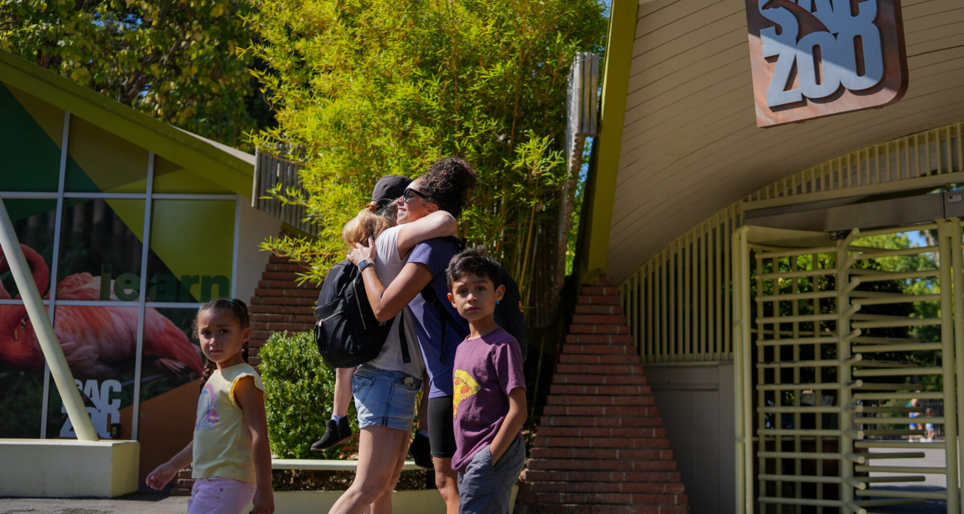 People in front of the Sacramento Zoo entrance. Photo by Denis Akbari.