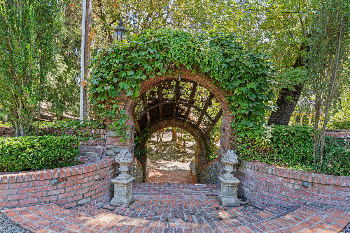 Used brick covers patios, walls and walkways throughout the property, including elaborate masonry work near the pool. The family estimates that more than 100,000 bricks were incorporated into the estate over the years.
