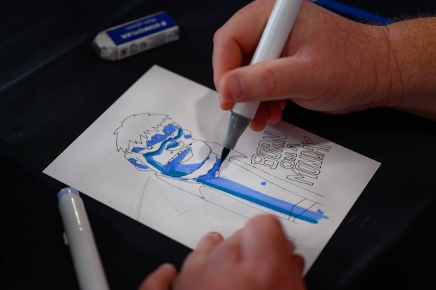 Comic book artist Ryan Cody, of Phoenix, Arizona, colors a drawing during the fourth annual Cape & Cowl Con held at Faction Brewing in Alameda, Calif., on Sunday, Aug. 30, 2026. The event is hosted by Oakland's Cape & Cowl Comics with 150 vendors, authors and artist attending. (Jose Carlos Fajardo/Bay Area News Group)