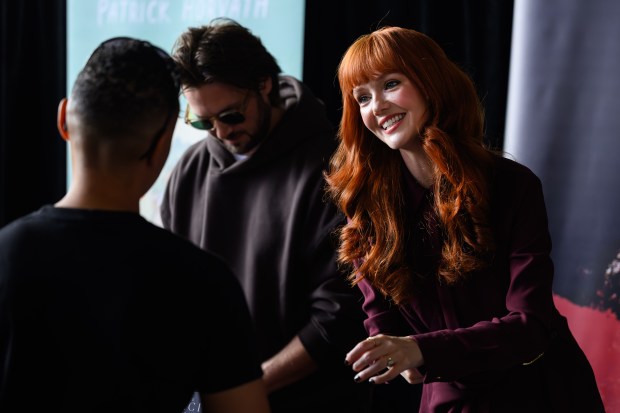 Actress and writer Hannah Rose May greets a fan during the fourth annual Cape & Cowl Con held at Faction Brewing in Alameda, Calif., on Sunday, Aug. 30, 2026. The event is hosted by Oakland's Cape & Cowl Comics with 150 vendors, authors and artist attending. (Jose Carlos Fajardo/Bay Area News Group)