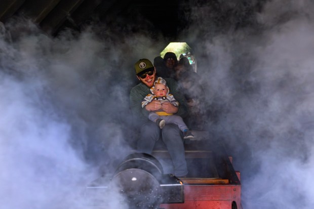 Aaron Kavanaugh, of Berkeley, holds onto his son Ernest, 1, while riding a steam train at the Redwood Valley Railway at Tilden Regional Park in Orinda, Calif., on Monday, Aug. 31, 2026. Visitors are treated to a 12-15 minute ride on a 15-inch gauge track which was built back in 1952. (Jose Carlos Fajardo/Bay Area News Group)