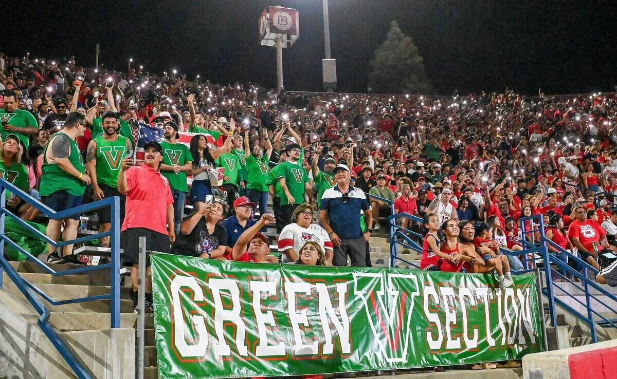 Fresno State fans in the Green V section cheer during the Bulldogs first home game of the season against Sacramento State at Valley Children's Stadium in Fresno on Saturday, Sept. 12, 2026.