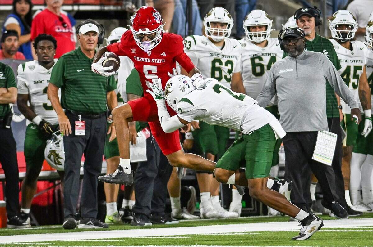 Fresno State's Josiah Freeman gets knocked out of bounds by Sacramento State's Dionte Thornton after a catch down the sideline in their game at Valley Children's Stadium in Fresno on Saturday, Sept. 12, 2026.