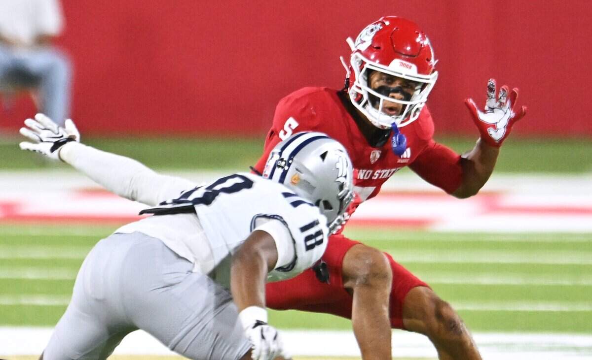 Fresno State wide receiver Josiah Freeman,spins away from Rice's Ahran Ogbor Saturday, Sept. 26, 2026 in Fresno. Rice led 17-14 at halftime.