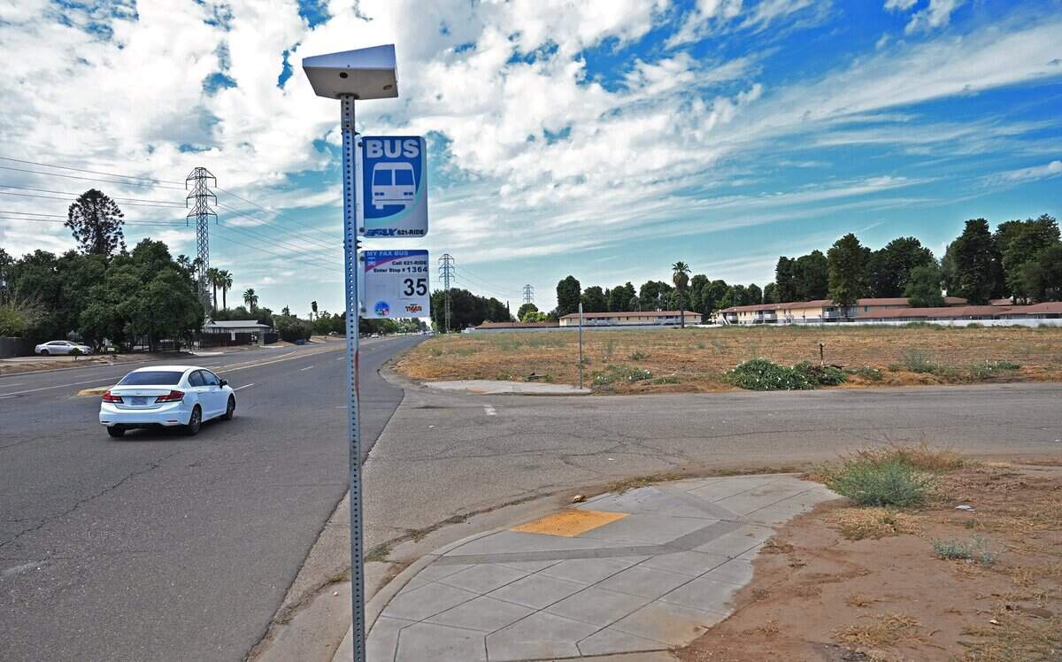 A bus stop is seen at Belmont and Dewitt avenues where a planned 104-unit housing project featuring cottage-style homes will be located. Photographed Tuesday, Sept. 8, 2026 in Fresno.