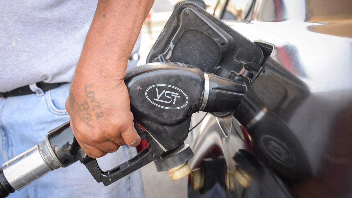 Peter Zamarripa of Fresno pumps gas at US Gas and Food on Clinton Avenue near Highway 99 in Fresno in 2019.