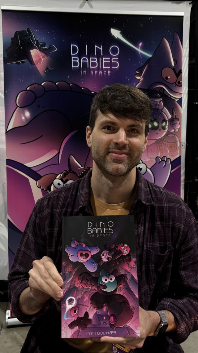 Matt Bolinger holding Dino Babies in Space