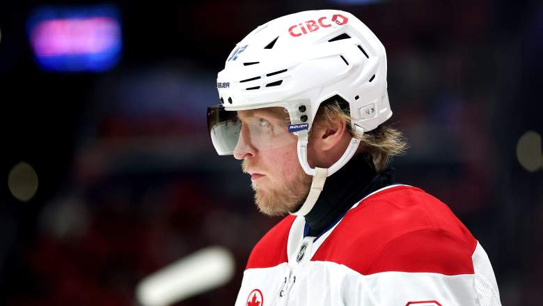 Patrik Laine, wearing a Montreal Canadiens uniform, stares straight ahead.