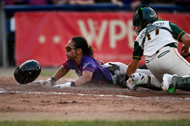 SPRINGFIELD, ILLINOIS - AUGUST 02: Joely Leguizamon #13 of the San Francisco Firebells slides into home plate against Beth Greenwood #17 of the Boston Hunters during the third inning against the Boston Hunters at Robin Roberts Stadium on August 02, 2026 in Springfield, Illinois. (Photo by Zoe Davis/Getty Images)