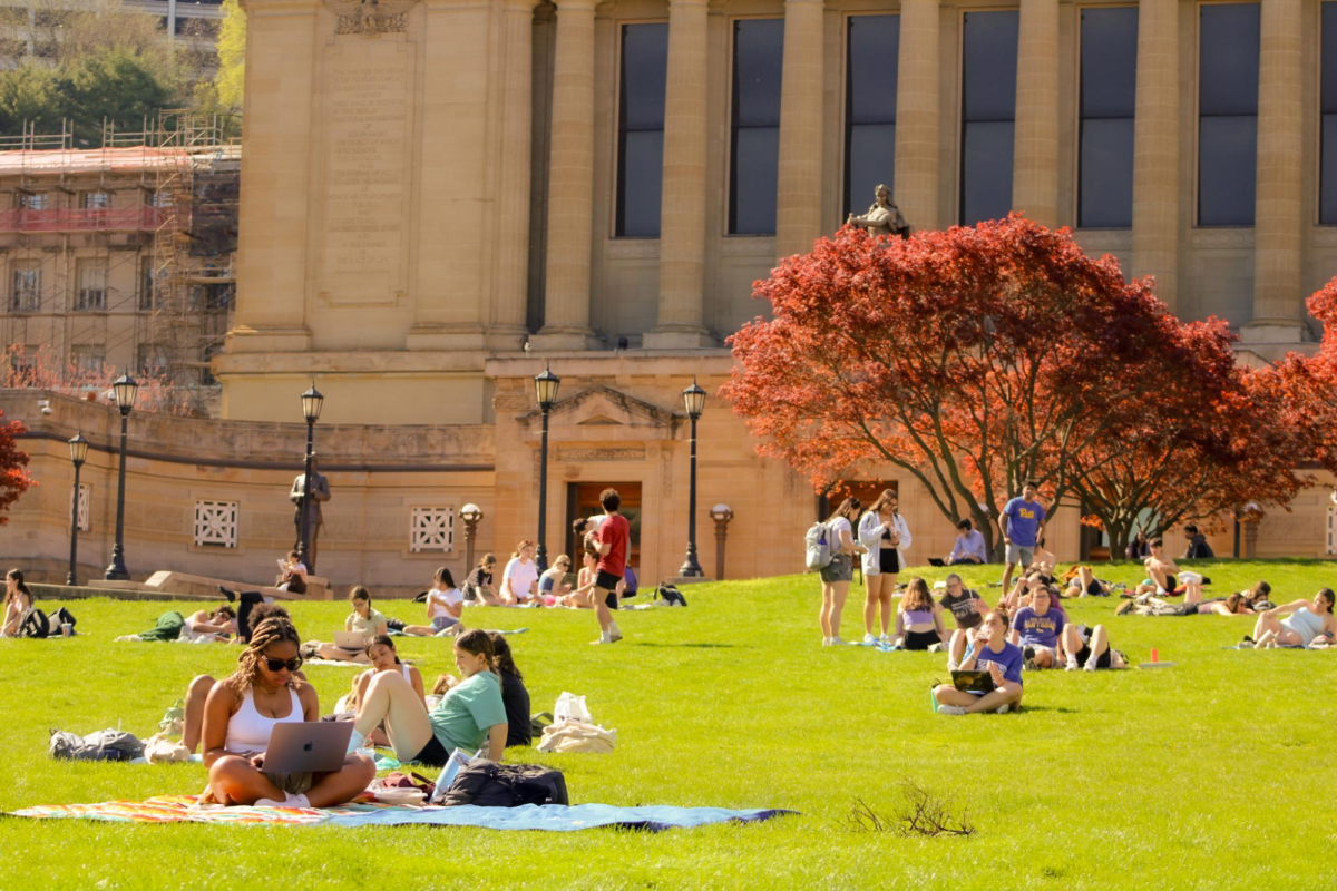 Students study on Soldiers and Sailors lawn.