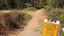 A sign warning hikers to be cautious amid an extreme heat warning was posted at San Dieguito Park Trail in Rancho Santa Fe on Sept. 9, 2026. (Mark Mullen)