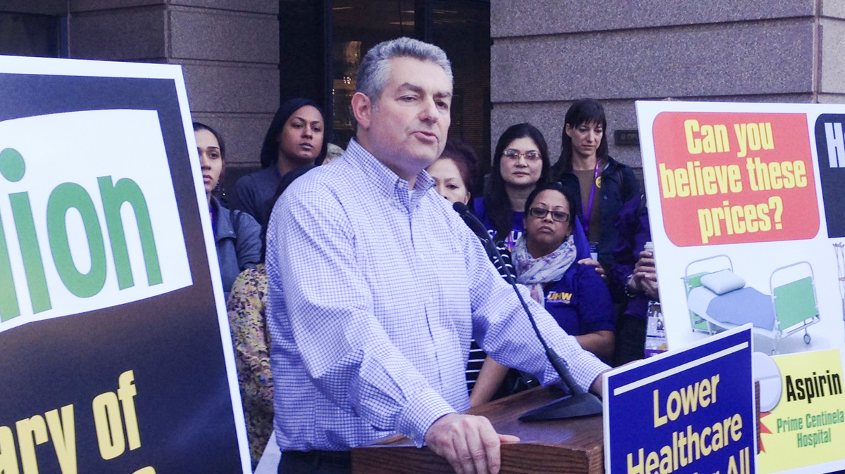 Dave Regan, president of SEIU-United Healthcare Workers West, unveils a pair of ballot initiatives In November 2013 outside the Attorney General’s Office in Sacramento.