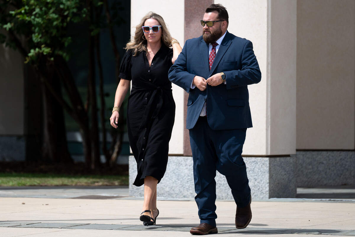 Attorney Tyler Cox, right, and Judge Ashlee Cole walk out of the Dan M. Russell Jr. U.S. Courthouse on Monday.