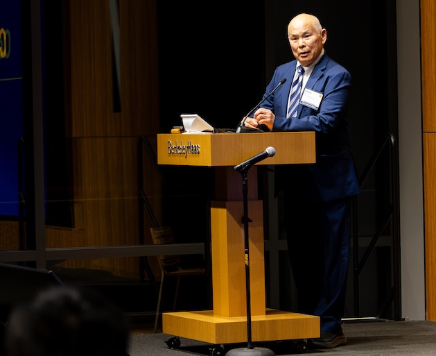 Gifford Fong standing at a podium